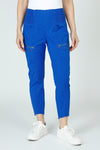 Wearables Acker Slim Pant in Honorable Blue, a bright blue.  Pull on Pant with shirred elastic panels at sides.  2 front slash pockets and zip cargo pockets.  High low hem. Inseam 26"_t_59448483283310