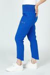Wearables Acker Slim Pant in Honorable Blue, a bright blue.  Pull on Pant with shirred elastic panels at sides.  2 front slash pockets and zip cargo pockets.  High low hem. Inseam 26"_t_59448483250542