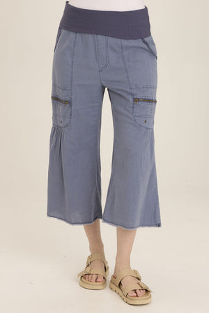 Wearables Pasqual Crop in Hypnotic Pigment.  Foldover jersey waistband with faux zipper placket.  2 deep front pockets.  Zipper detail and grommets below pockets.  Softly gathered at pockets.  2 rear patch pockets.  Wide leg with slightly flared hem and raw edge. 22" inseam._60009108472174
