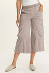 Wearables Faulkner Crop Pant in Foxglove, a gray beige.  Jersey knit elastic waistband pull on wide leg crop.  2 front slash pockets and 2 front flap cargo pockets.  Antique brass grommet trim.  24" inseam._t_61437221962094