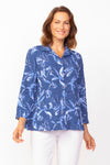Habitat Pucker Scoop Pocket Jacket in Twilight blue with a blue and white floral print. Adjustable wire collar button down blouse/jacket with 3/4 sleeve with cuff. Front rounded patch pockets with button detail. Back tab with 2 buttons. Gently gathered below tab. Relaxed fit._t_35122609094856