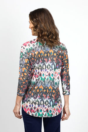 Tribut Geometric Abstract boxy Top. Bright multi colors with geometric oval overprint. Crew neck 3/4 sleeve top with curved hem. Fused seams. Relaxed fit._35043103342792