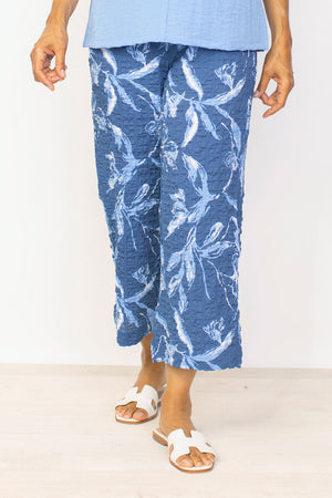 Habitat Flat Front Flood Pant in Twilight blue with blue and white floral. Flat front pull on pant with elastic back. Side slash pockets. Relaxed through hip and thigh. Relaxed leg. 26" inseam._35122809635016
