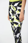 Joseph Ribkoff Abstract Print Ankle Pant. Black and white print with pops of lime. Pull on pant with 3" waistband. Snug through hip and thigh, falls straight to hem. 27" inseam._t_34829130006728