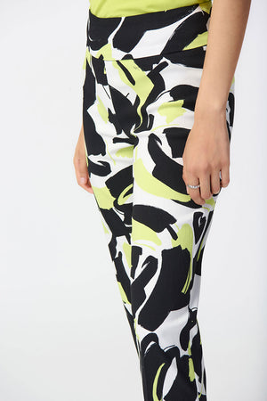 Joseph Ribkoff Abstract Print Ankle Pant. Black and white print with pops of lime. Pull on pant with 3" waistband. Snug through hip and thigh, falls straight to hem. 27" inseam._34829130006728