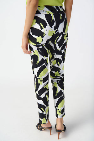 Joseph Ribkoff Abstract Print Ankle Pant. Black and white print with pops of lime. Pull on pant with 3" waistband. Snug through hip and thigh, falls straight to hem. 27" inseam._34829129777352