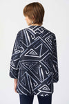 Joseph Ribkoff Geometric Jacquard Jacket. White bold geometric print on a midnight blue background. Stand collar with asymmetric 1 button closure. 3/4 sleeve with wide cuff. High low hem. Relaxed fit._t_34829092913352