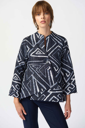 Joseph Ribkoff Geometric Jacquard Jacket.  White bold geometric print on a midnight blue background.  Stand collar with asymmetric 1 button closure.  3/4 sleeve with wide cuff.  High low hem.  Relaxed fit._34829092946120
