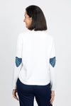 Lisa Todd Patch Magic Sweater in White. Cotton knit crew neck with 5 button front placket. Long sleeves. Heart patches with hand embroidery at elbows. Curved hem. Classic fit._t_35110323421384