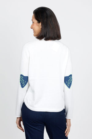 Lisa Todd Patch Magic Sweater in White. Cotton knit crew neck with 5 button front placket. Long sleeves. Heart patches with hand embroidery at elbows. Curved hem. Classic fit._35110323421384