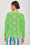 Lisa Todd Super Stars Sweater in Lime Crush. V neck open weave sweater with solid intarsia hearts and stars. Long sleeves Drop shoulder. Hand embroidered detail. Classic fit._t_35110375620808