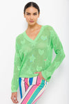 Lisa Todd Super Stars Sweater in Lime Crush.  V neck open weave sweater with solid intarsia hearts and stars.  Long sleeves  Drop shoulder.  Hand embroidered detail.  Classic fit._t_35110375555272
