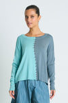 Planet Half Whipped Sweater in Haze/Vapor.  Crew neck knit with 1/2 and 1/2 vertical color block.  Whipstitch detail in lava down center front. Long sleeves with drop shoulder. Rib trim at neck.  One size fits many.  Oversized fit.
_t_61189666079086