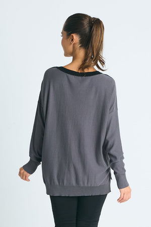 Planet Freeway Sweater in Multi.  Black, gray, vapor, white and yellow mix of color block and geometric shapes.  Crew neck long sleeve sweater with dropped shoulders.  Plain back.  Rib trim at neck, hem and cuff.  High low hem.  Side slits.  One size fits many.  Oversized fit._61012375830894