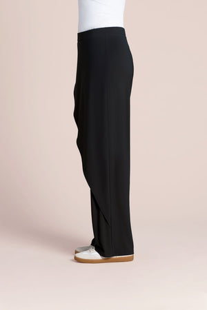 Sympli Suitable Rapt Pant in Black.  Pull on pant with set in waistband.  Draped asymmetric panel on across left front leg.  Straight leg.  Plain back.  30" inseam._61386354393454