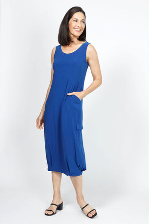 Sympli Nu Pleat Hem Tank Dress in Twilight Blue, a medium bright blue.. Scoop neck sleeveless dress. Defined waist with gathered bubble skirt with small pleats at hem. 2 front slash in seam pockets. Contour seaming. Single cargo pocket with flap on side. Relaxed fit._35033435373768
