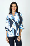Hinson Wu Xena Abstract Zip Back Blouse in Blue combo.  Abstract shapes in shades of blue, tan and white.  Pointed collar with hidden button placket.  Single gold button exposed at neck.  3/4 sleeve with split turn back cuff.  Zip back with solid navy lining.  Relaxed fit._t_59647641059694