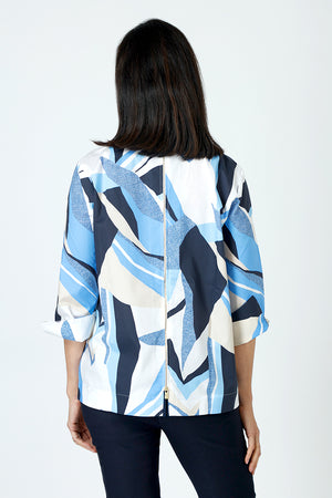 Hinson Wu Xena Abstract Zip Back Blouse in Blue combo.  Abstract shapes in shades of blue, tan and white.  Pointed collar with hidden button placket.  Single gold button exposed at neck.  3/4 sleeve with split turn back cuff.  Zip back with solid navy lining.  Relaxed fit._59647641026926