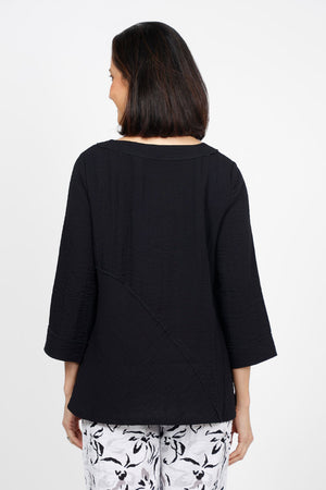 Habitat Travel Swing Tunic in Black. Solid lightly crinkled top with crew neck and 3/4 sleeve. Diagonal seaming in front and back with raised edge. Swing shape. Slightly oversized fit._35123305382088
