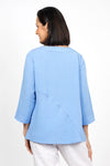 Habitat Travel Swing Tunic in Cornflower. Solid lightly crinkled top with crew neck and 3/4 sleeve. Diagonal seaming in front and back with raised edge. Swing shape. Slightly oversized fit._t_35123307675848
