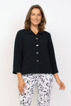 Habitat Travel Pleat Back Jacket in Black.   Spread collar button down with matching novelty buttons.  2 front angled pockets with flap detail.  3/4 sleeve. Back yoke with 3 button tab detail.  High low hem.  A line shape. Relaxed fit._t_35123615891656