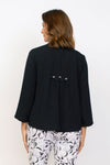 Habitat Travel Pleat Back Jacket in Black.   Spread collar button down with matching novelty buttons.  2 front angled pockets with flap detail.  3/4 sleeve. Back yoke with 3 button tab detail.  High low hem.  A line shape. Relaxed fit._t_35123615858888