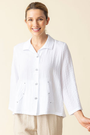 Habitat Travel Pleat Back Jacket in White.  Spread collar button down with matching novelty buttons.  2 front angled pockets with flap detail.  3/4 sleeve. Back yoke with 3 button tab detail.  High low hem.  A line shape. Relaxed fit._59962226082158