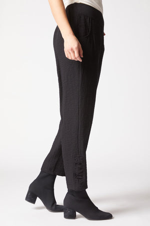 Habitat Travel Ruched Ankle Pant in Black.  Pull on textured pant with wide dropped waistband.  2 front slash pockets.  Ruching detail at side leg.  27" inseam._61477088559470