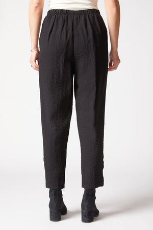 Habitat Travel Ruched Ankle Pant in Black.  Pull on textured pant with wide dropped waistband.  2 front slash pockets.  Ruching detail at side leg.  27" inseam._61477088625006