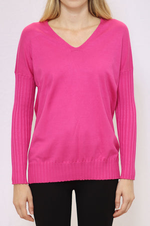 Metric V Neck Ribbed Sleeve Sweater in Bright Rose. V neck sweater with dropped shoulder and long ribbed sleeve. Ribbed hem with side slits. Relaxed fit._34771093061832