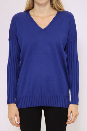 Metric V Neck Ribbed Sleeve Sweater in Galaxy Blue. V neck sweater with dropped shoulder and long ribbed sleeve. Ribbed hem with side slits. Relaxed fit._34771088474312