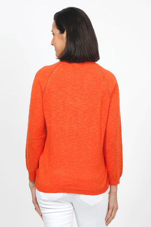 Metric Pointelle Crew Neck Sweater in Orange. Crew neck long sleeve sweater with raglan sleeves. Pointelle stitching at seams. Rib trim at neck, hem and cuff. Classic fit._35103948636360