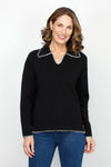 Metric 2 Tone Whipstitch Polo Sweater in Black.  Pointed collar with notched v neck pullover.  Long sleeves.  Dropped shoulders.  Ivory whipstitch around neckline, collar, cuff and hem.  Side slits.  Relaxed fit._t_61478426870126