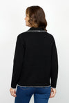 Metric 2 Tone Whipstitch Polo Sweater in Black.  Pointed collar with notched v neck pullover.  Long sleeves.  Dropped shoulders.  Ivory whipstitch around neckline, collar, cuff and hem.  Side slits.  Relaxed fit._t_61478426902894