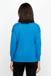 Metric Side Seam Sweater in Indigo Blue.  Square neck long sleeve sweater with dropped shoulder.  Raised seam detail at shoulders.  Off center raised seams in front and back.  Deep rib at hem and cuff. Side slits.  Relaxed fit._t_61376537756014