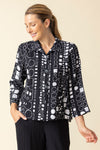 Habitat Travel Circle Pleat Back Jacket in Black with a white circle print.  Spread collar button down jacket with novelty buttons.  3/4 sleeve.  2 front angled pouch pockets with sewn flap detail.  Back  center tab with 3 button detail and soft pleating. Relaxed fit._t_59962933346670