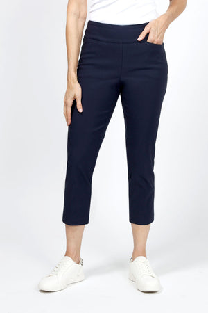 The Holland Ave Millennium Crop with Pocketin Navy. Techno stretch pull on pant with 2 front slash pockets. 2 1/2" waistband. Slim through leg. 26" inseam._34960221667528