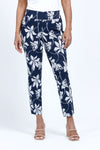 Holland ave Lilies Print Ankle Pant.  White lily print on a midnight blue background.  Pull on pant with 2 1/2" curved waistband.  Snug through hip and thigh, falls straight to hem.  28" inseam._t_34888831041736