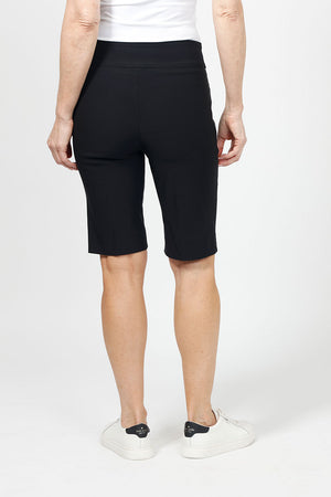 Holland Ave Bermuda Short in Black. 2 1/2" waistband with 2 front slash pockets. 11" inseam. Snug through stomach and hip, slim to hem._34995042156744