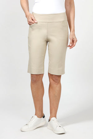 Holland Ave Bermuda Short in Stone. 2 1/2" waistband with 2 front slash pockets. 11" inseam. Snug through stomach and hip, slim to hem._34995042091208