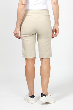 Holland Ave Bermuda Short in Stone. 2 1/2" waistband with 2 front slash pockets. 11" inseam. Snug through stomach and hip, slim to hem._34995042287816