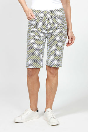 Holland Ave Yellow Geo Dot Bermuda.  Black & white medallion print with yellow accents.  2 1/2" waistband with 2 front slash pockets.  Pull on short.  Snug through stomach and hip, slim through thigh to hem.  11" inseam._34995263897800