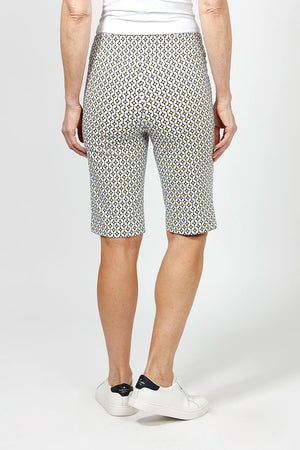 Holland Ave Yellow Geo Dot Bermuda. Black & white medallion print with yellow accents. 2 1/2" waistband with 2 front slash pockets. Pull on short. Snug through stomach and hip, slim through thigh to hem. 11" inseam._34995263832264
