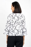 Habitat Travel Placket Shirt in White. Gray and black soft floral print on a white background. Spread collar button down shirt with single exposed novelty button and hidden button placket. 3/4 sleeve with tulip hem. Black piping trim on placket and cuff. Relaxed fit._t_35135369347272