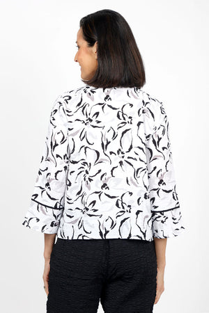 Habitat Travel Placket Shirt in White. Gray and black soft floral print on a white background. Spread collar button down shirt with single exposed novelty button and hidden button placket. 3/4 sleeve with tulip hem. Black piping trim on placket and cuff. Relaxed fit._35135369347272