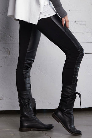 Planet Vegan Leather Sexy Legging in Black/Black. Elastic waist pull on legging. Front is vegan leather, back half is jersey. Ruching at bottom._61181348381038