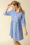 Habitat Crinkle Miami Lanai Dress in Rain.  Multi blue miniature geometric print.  Pointed collar button down shirt dress with drop waist. Double tiered skirt.  3/4 sleeve with roll button tab.  Side seam pockets.  Contrast print on collar and placket.  Relaxed fit._t_60331528585582