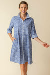 Habitat Crinkle Miami Lanai Dress in Rain.  Multi blue miniature geometric print.  Pointed collar button down shirt dress with drop waist. Double tiered skirt.  3/4 sleeve with roll button tab.  Side seam pockets.  Contrast print on collar and placket.  Relaxed fit._t_60331528552814