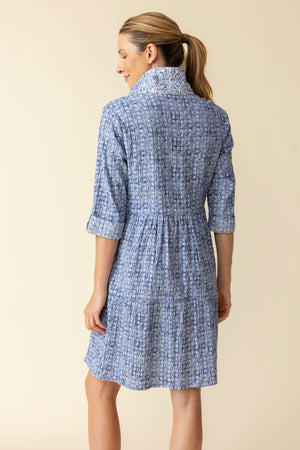 Habitat Crinkle Miami Lanai Dress in Rain.  Multi blue miniature geometric print.  Pointed collar button down shirt dress with drop waist. Double tiered skirt.  3/4 sleeve with roll button tab.  Side seam pockets.  Contrast print on collar and placket.  Relaxed fit._60331528520046