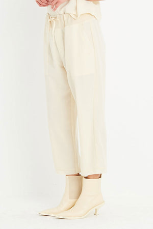 Planet Peachskin Sweat Pant in Butter. Washable silk pull on straight leg crop pant. Drawstring waist. 2 side pockets. 26" inseam._34933053128904